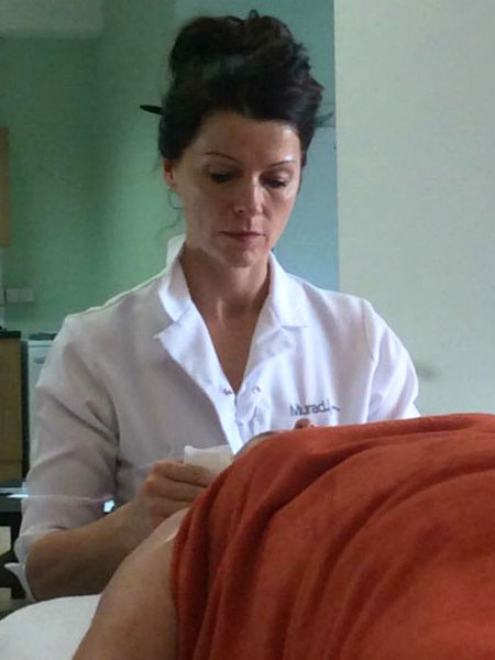 Rebecca Pitchers giving Murad Facial